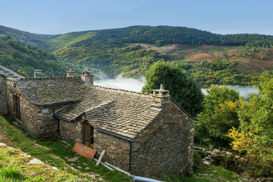 rustic stone houses with  Mont Loz&egrave;re in the background in Cevennes, France